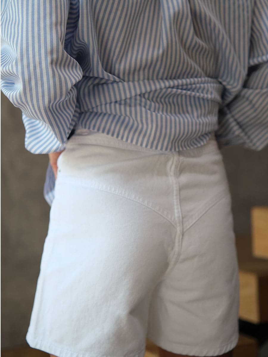 Шорти джинсові білого кольору з відстрочками 5