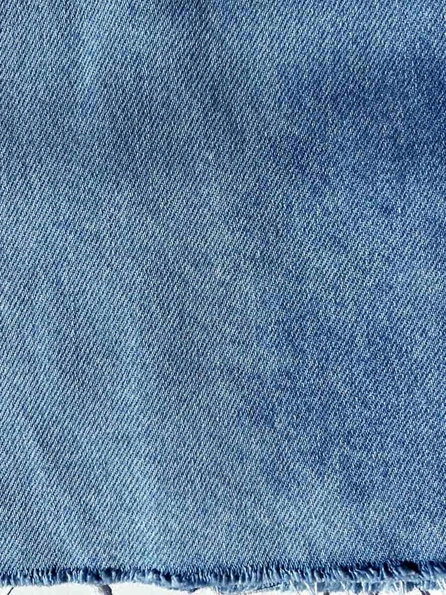 Спідниця міді джинсова блакитна з розрізом та не обробленим низом 1