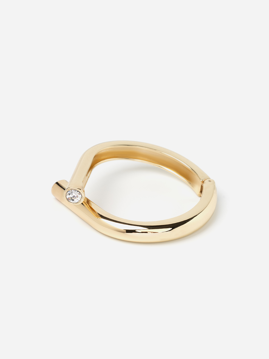 Браслет кафф золотого кольору з лого всередині 1