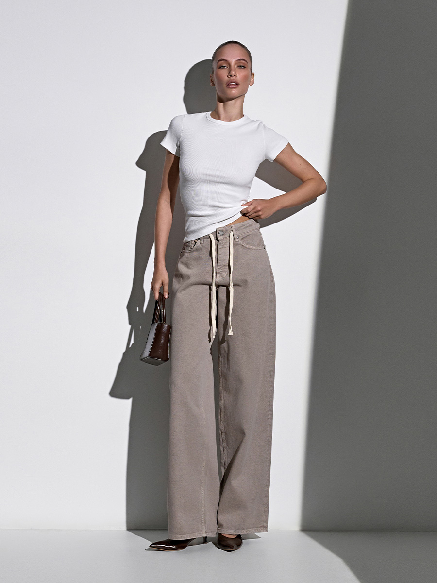 Джинси широкі бежевого кольору зі шнурком 1