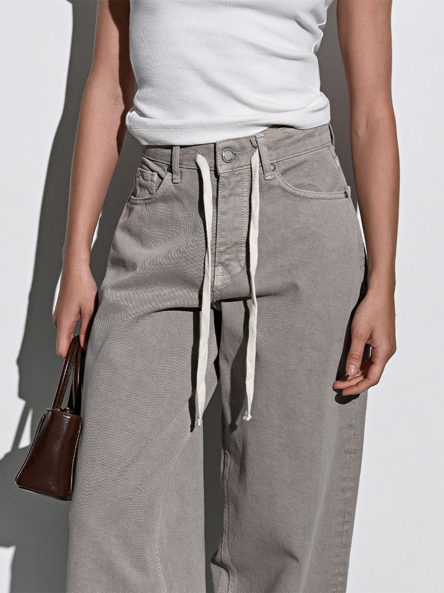 Джинси широкі бежевого кольору зі шнурком 1