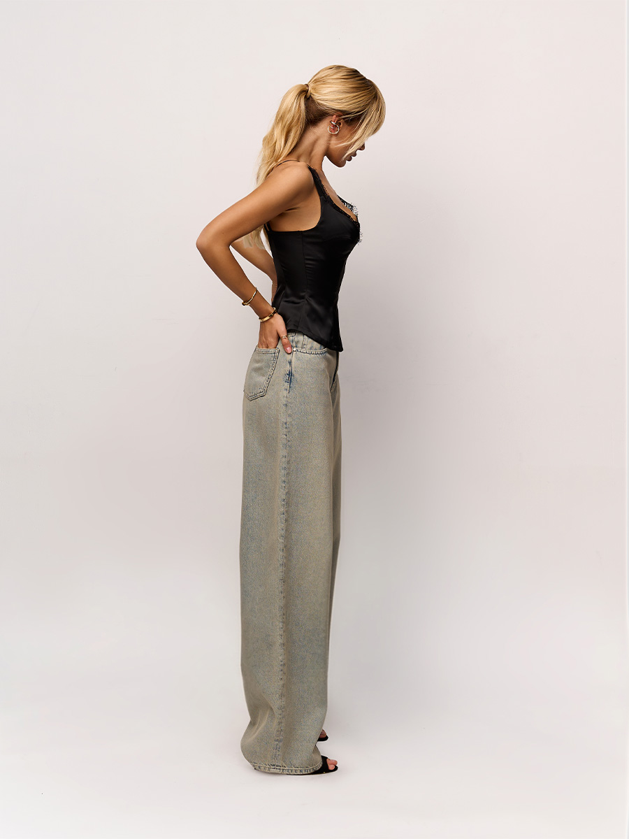 Джинси баггі сіро-блакитного кольору з низкою посадкою та з витачками на колінах