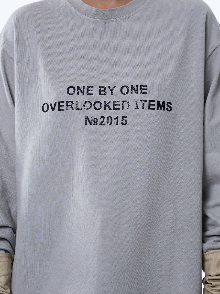 Лонгслів оверсайз сірого кольору з принтом OVERLOOKED ITEMS 1