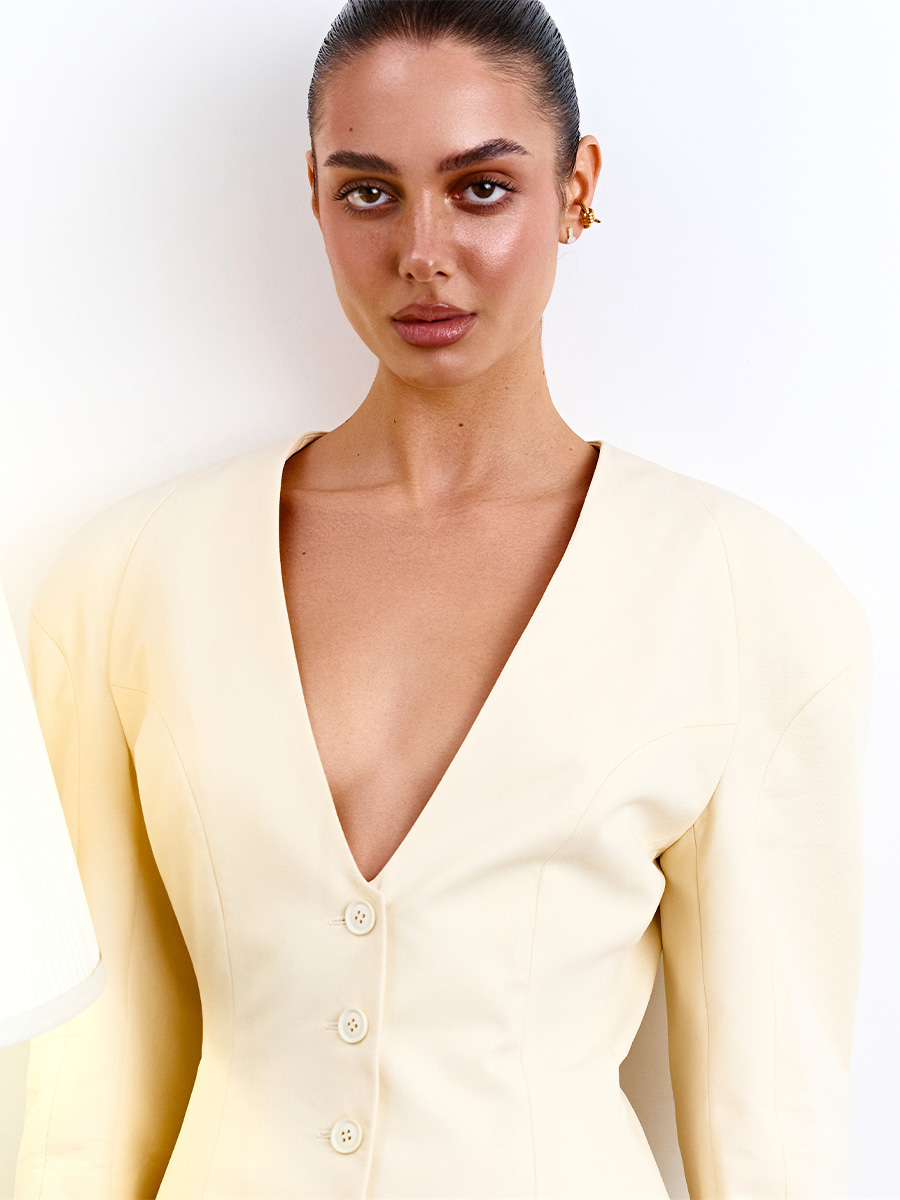 Жакет без коміра світло-жовтого кольору з об'ємним рукавом 1