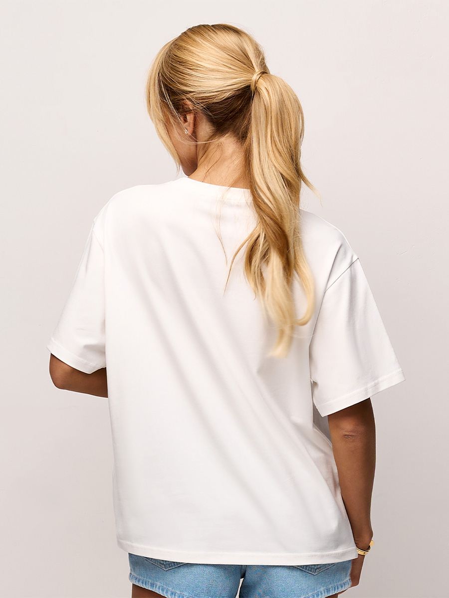 Футболка оверсайз білого кольору з принтом I`m boring baby all i do is make money 1